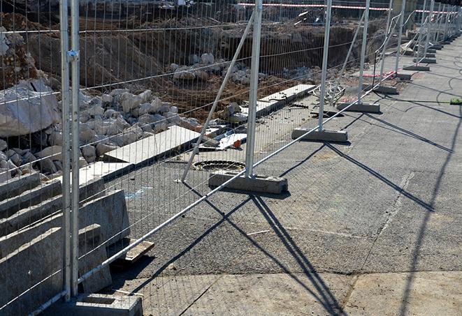 temporary fence panels set up for a project, keeping pedestrians safe and away from work zones